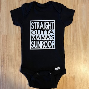 May include: Black baby onesie with white text that reads "STRAIGHT OUTTA MAMA'S SUNROOF".