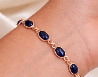 Pulsera de plata de ley 925 con lapislázuli, chapada en oro rosa, con delicada cadena y gema ovalada.