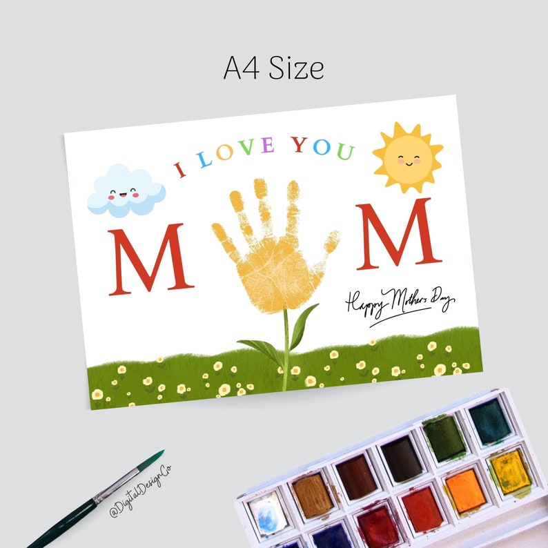 May include: A printable Mother's Day card with a handprint flower, a sun, a cloud, and the words "I love you Mom" in colorful letters. The card also says "Happy Mother's Day".