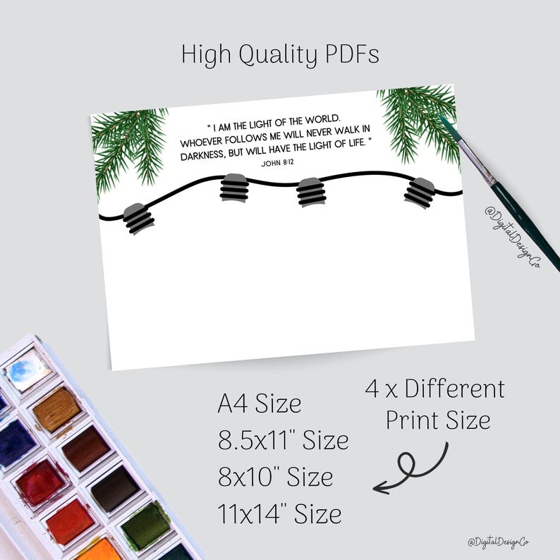 May include: White printable art print with the text "I AM THE LIGHT OF THE WORLD." The design includes a string of lights, evergreen branches, and a watercolor palette. The print is available in A4, 8.5x11", 8x10", and 11x14" sizes.