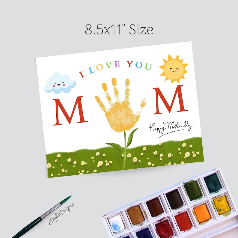 May include: A printable 8.5x11 inch card with a handprint flower design. The card says "I love you MOM" with a happy sun and cloud. The text "Happy Mother's Day" is handwritten in cursive.