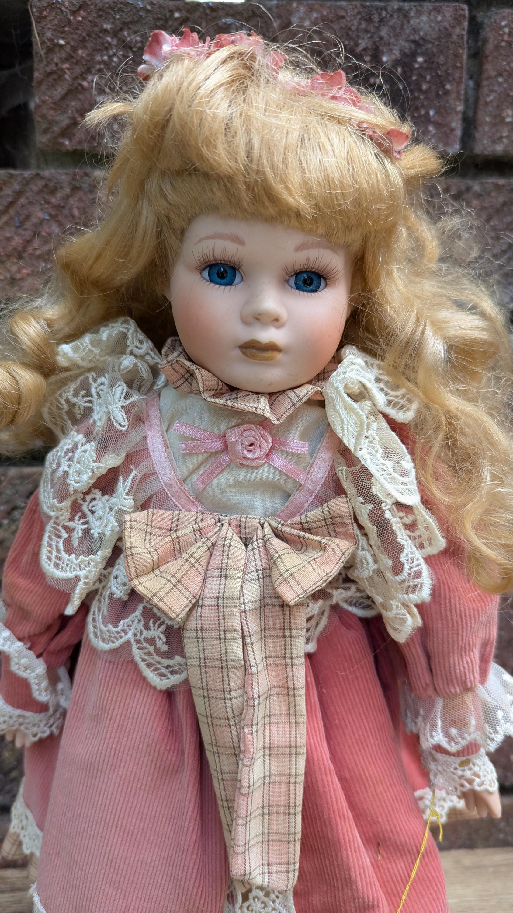 Leonardo Collection “rebecca” Porcelain Doll in Pink Corduroy