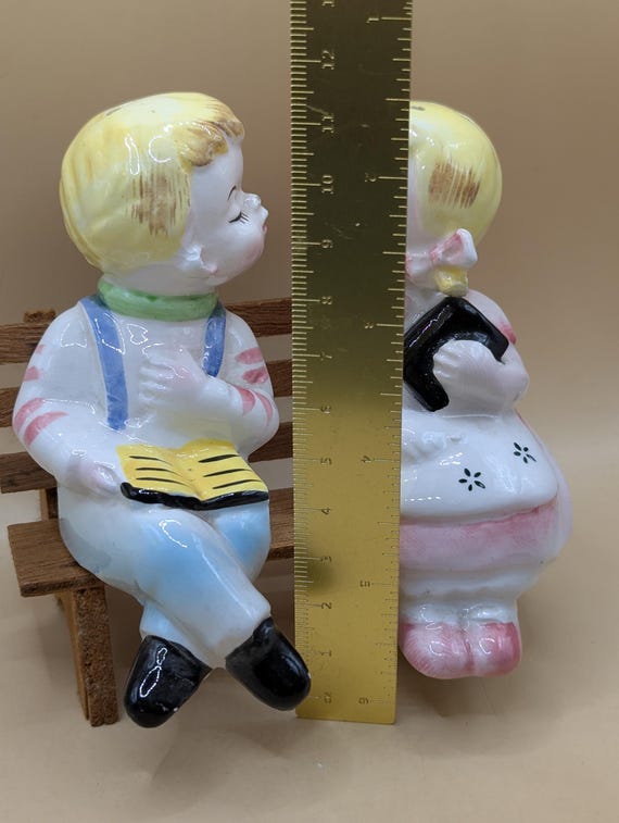 1950s Kissing Boy and Girl Sitting on A Wooden Bench, Salt Pepper