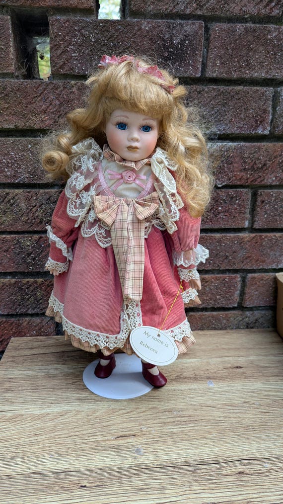 Leonardo Collection “rebecca” Porcelain Doll in Pink Corduroy