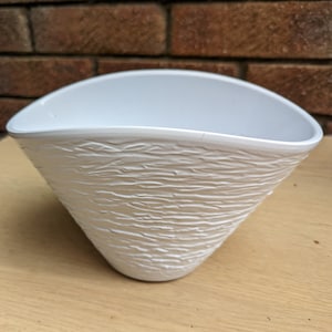 White ceramic vase, unusual shape and texture