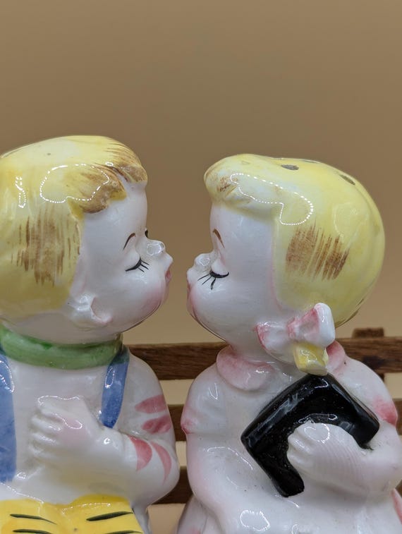 1950s Kissing Boy and Girl Sitting on A Wooden Bench, Salt Pepper
