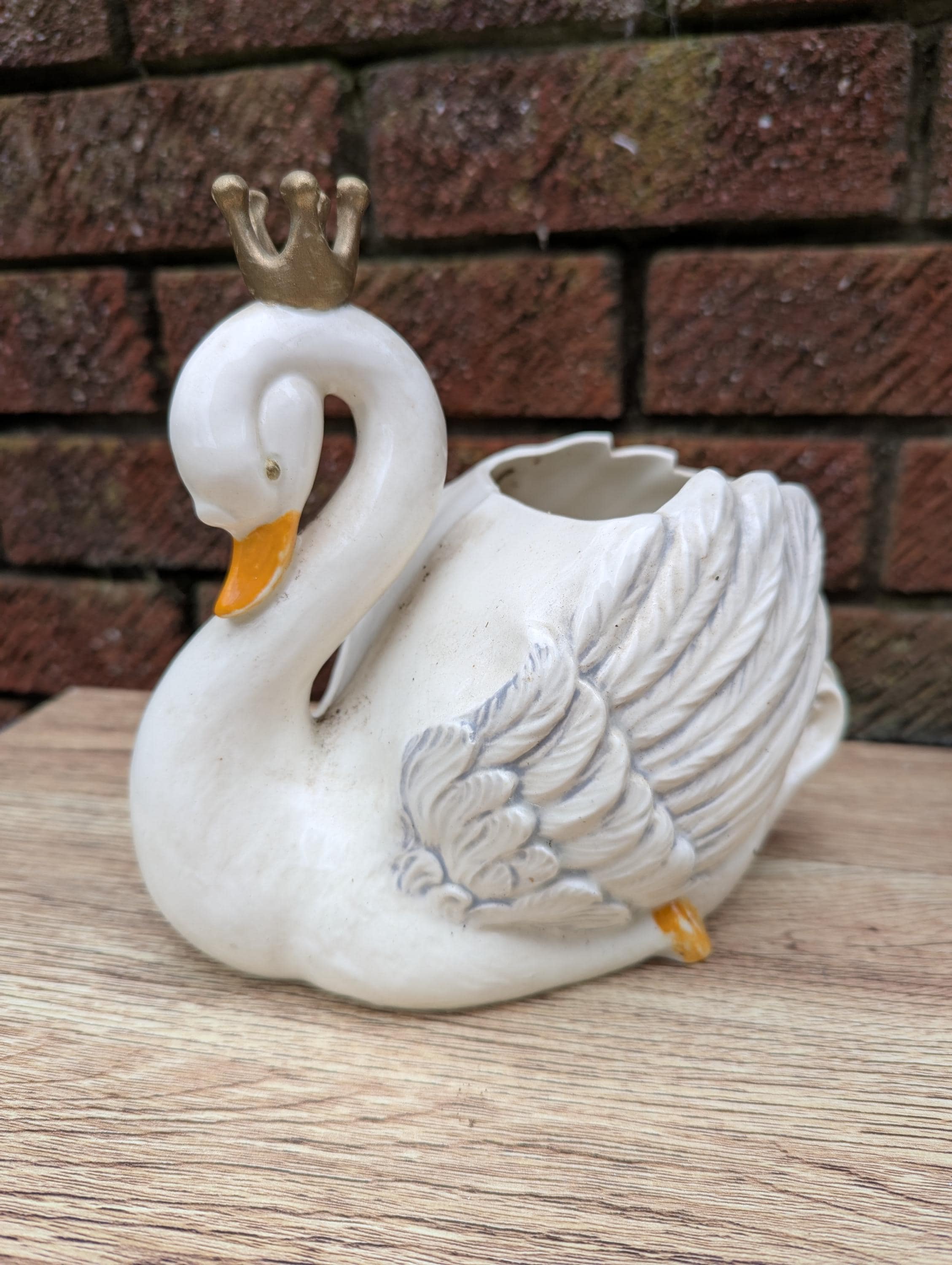 A Ceramic Swan With a Gold Crown, an Opening Would Allow Paint