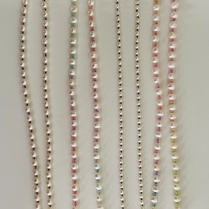 Hand knotted Freshwater Pearl necklace on colorful silk string with sailor clasp. Available in Solid gold or Sterling silver. Gifts for her.