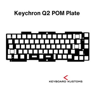 May include: Black and white image of a Keychron Q2 POM plate for a mechanical keyboard. The plate is a solid black color and has a grid of holes for the key switches.