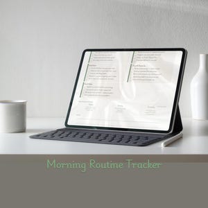 May include: A digital tablet displaying a morning routine tracker, resting on a keyboard case. The screen shows a checklist with various tasks. A white stylus rests on the table. A white mug and vase are also present. The text "Morning Routine Tracker" is at the bottom.