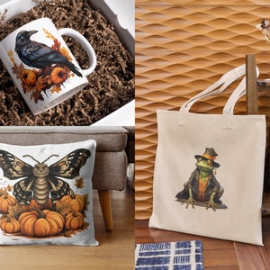 May include: A set of three fall-themed products featuring a black raven on a mug, a butterfly on a pillow, and a frog wearing a hat on a tote bag. All three designs feature pumpkins and autumn leaves.