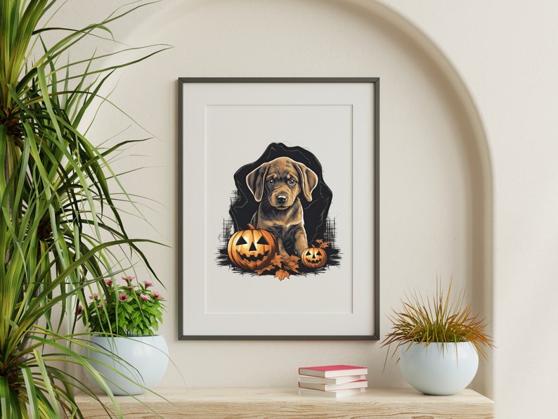 May include: A brown and white puppy dog sits in front of two orange jack-o'-lantern pumpkins with carved faces. The dog is surrounded by fall leaves. The image is in a black frame.