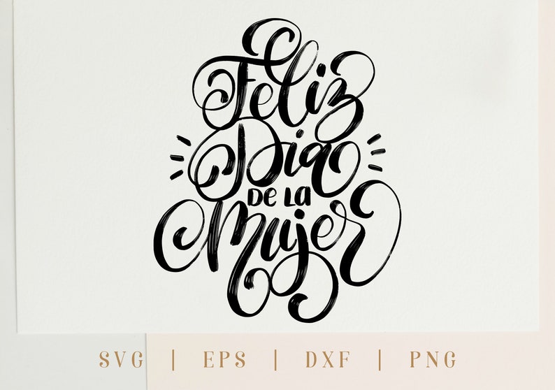 May include: Black and white calligraphy lettering that reads "Feliz Dia de la Mujer" which translates to "Happy Women's Day" in English.