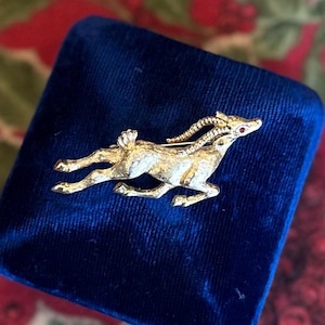 Vintage Signed MONET Gold Tone Leaping Antelope Gazell Brooch Red Rhinestone Eye Holiday