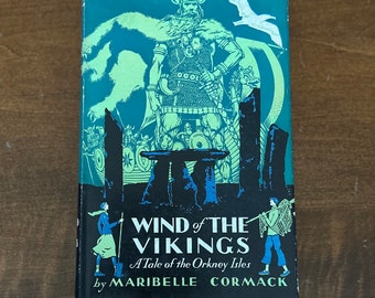 May include: A vintage book cover with a green background and a black and white illustration of a Viking warrior. The title is "Wind of the Vikings: A Tale of the Orkney Isles" by Maribelle Cormack.