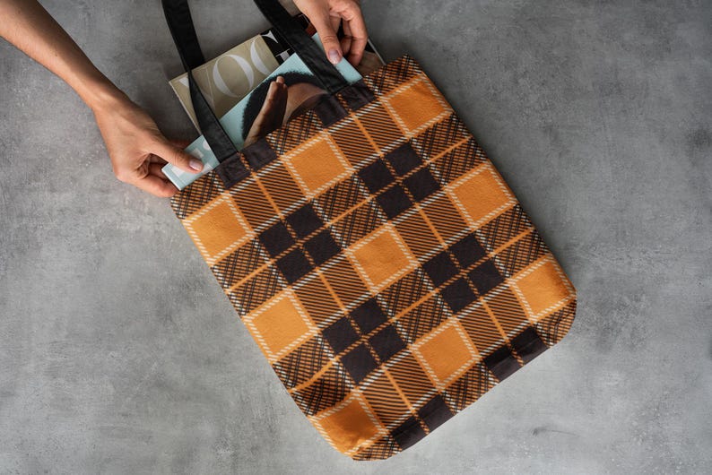 Orange and black plaid tote bag perfect for your fall aesthetic. Available in three sizes and multiple color options for the handles.