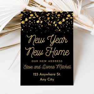 May include: Black and gold new year's card with gold glitter confetti and the text "New Year New Home" and "Our New Address Steve and Donna Mitchell 123 Anywhere St. Any City"