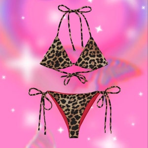 May include: A leopard print bikini with a triangle top and a high-cut bottom. The bottom has a red lining.