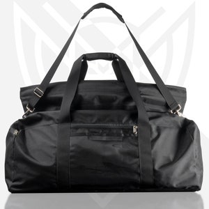 May include: A black duffel bag with a top handle and a shoulder strap. The bag has a zippered pocket on the front.