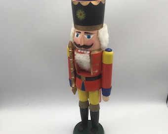 Vintage Seiffener Volkskunst German wooden nutcracker, likely a "Red King" or "Red Hussar" character.