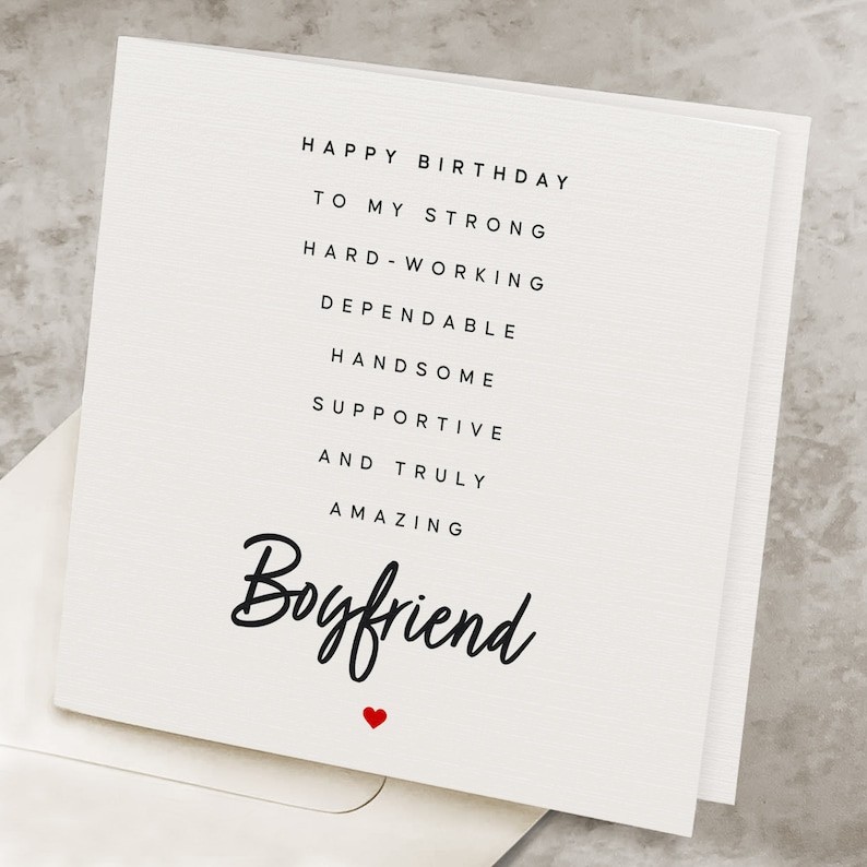 May include: White card with black text that reads "Happy Birthday to my strong, hard-working, dependable, handsome, supportive and truly amazing Boyfriend". A small red heart is at the bottom of the card.