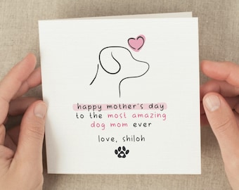 May include: A white card with a pink heart and a simple line drawing of a dog's head. The card reads "Happy Mother's Day to the most amazing dog mom ever, love, Shiloh".