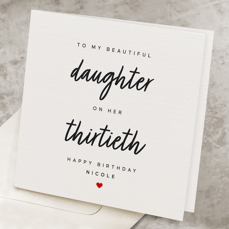 May include: A white card with black text that reads "To my beautiful daughter on her thirtieth Happy Birthday Nicole" with a small red heart.