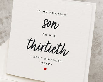 May include: White card with black text that reads "To my amazing son on his thirtieth Happy Birthday Joseph" with a red heart at the bottom.