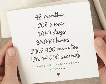 May include: A white card with black text that reads "48 months, 208 weeks, 1,460 days, 35,040 hours, 2,102,400 minutes, 126,144,000 seconds. Happy 4th Anniversary Stephen." A small red heart is below the text.