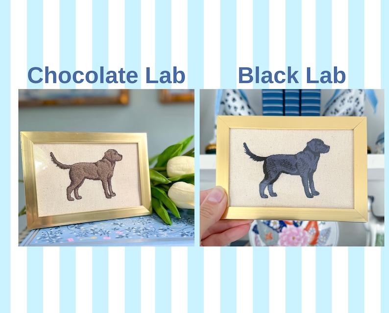 May include: Two framed embroidery pieces depicting Labrador Retrievers. The top piece reads "Black Lab" and shows a black dog. The bottom piece reads "Chocolate Lab" and shows a brown dog.