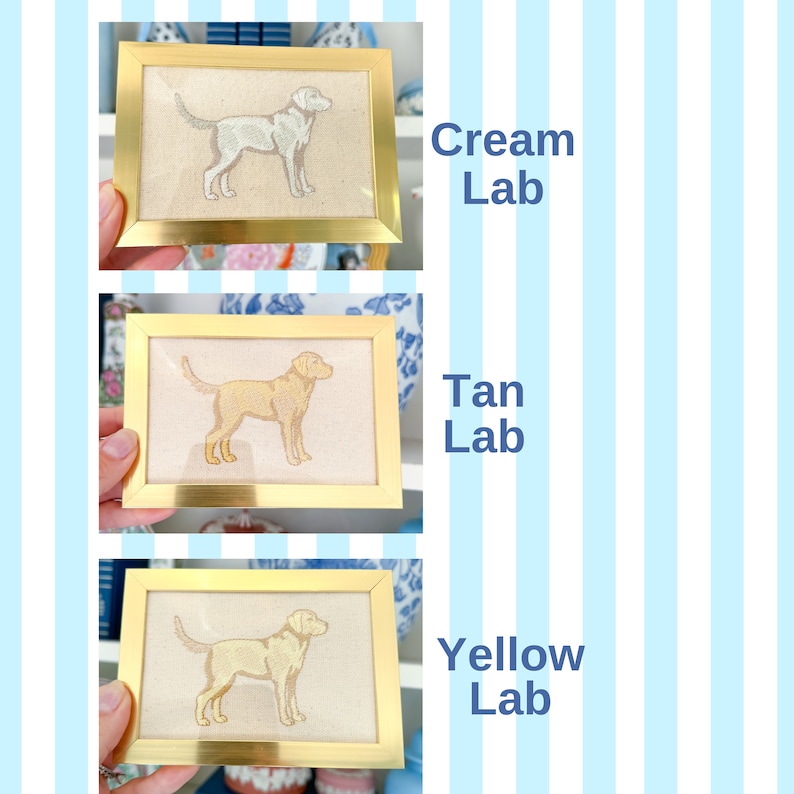 May include: Three framed embroidery pictures of Labrador Retrievers in different colours: cream, tan, and yellow. Each picture has a gold frame and a white background.