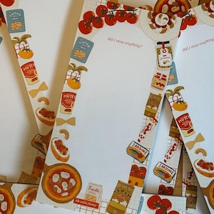 May include: Several notepads with a food-themed design. Each notepad has a border of tomatoes, pasta, and tinned goods. The text "did I miss anything?" is printed on each notepad.