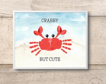 May include: A red crab made with handprints on a watercolor background with the text "Crabby But Cute".