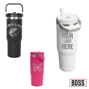 May include: Three insulated tumblers in black, white, and pink. The black tumbler has "DIRTY D. RAY" and a fish graphic. The white tumbler has "YOUR LOGO HERE". The pink tumbler features a butterfly design. All have handles.