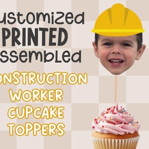 May include: Customized printed and assembled construction worker cupcake toppers. The toppers feature a child's face with a yellow hard hat.