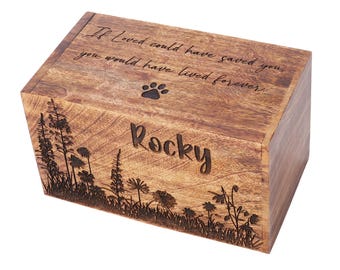 May include: A wooden pet urn with a rectangular shape. The urn is engraved with the name "Rocky", a paw print, and the inscription "If love could have saved you, you would have lived forever." The front of the urn features an etched floral design.