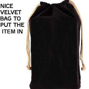 May include: A black velvet drawstring bag with a gold cord. The bag is empty.