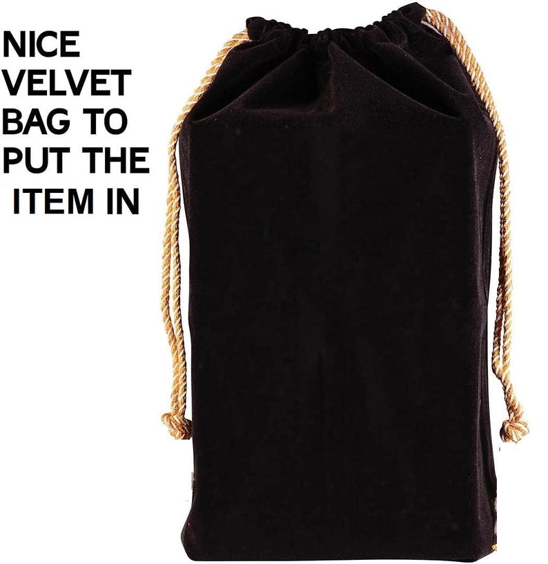 May include: A black velvet drawstring bag with a gold cord. The bag is empty.