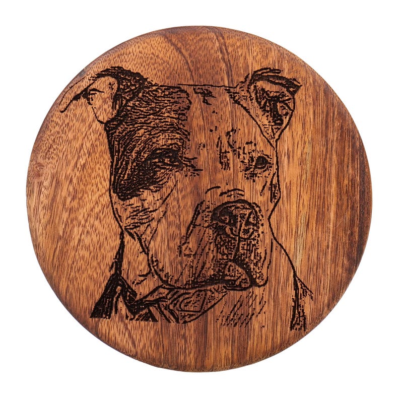 May include: A wooden round coaster with a laser engraved image of a brown and black pit bull dog.