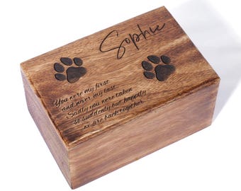 May include: A wooden pet urn with a personalized inscription that reads "You were my first and never my last... Sadly you were taken so suddenly but happily we are back together." The urn also features the name "Sophie" and two paw prints.
