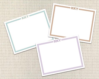 May include: Three blank note cards with different colored borders. Each card has the text "KKY" in the top right corner. The borders are light blue, brown, and purple.