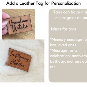 May include: Two brown leather tags with black text. One tag reads "Grandma Natalie", the other reads "In Memory of Marilee". The image also includes text that says "Add a Leather Tag for Personalization".