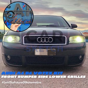 May include: Black Audi A4 B6 with a Votex kit. The car has a black front bumper with a black mesh grille and a black Audi logo. The car is parked on a street with a blue sky in the background. #JoinTheFutureOfAutomotive