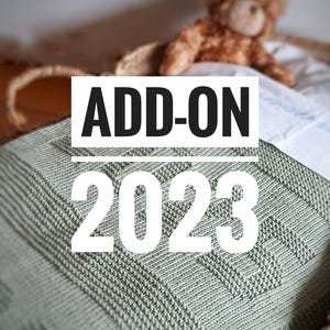 May include: A sage green knitted blanket with a geometric pattern, displayed in a woven basket. The text "ADD-ON 2023" is overlaid on the blanket. A brown teddy bear is visible in the background.