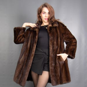 May include: A set of three ceramic mugs with a speckled, matte finish in cream, light grey, and dark grey. Each mug has a simple, minimalist design, ideal for tea or coffee.