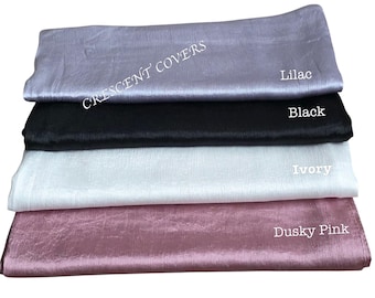 May include: Four fabric samples in Lilac, Black, Ivory, and Dusky Pink. The samples are stacked, with the Lilac sample on top. The text "CRESCENT COVERS" is visible in the upper left corner. Each sample has a label with its color name.