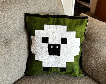Luxury patchwork sheep quilted cushion cover.
