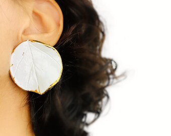 Large ear studs in white and gold porcelain with a handmade circular organic leaf shape.