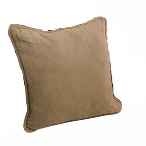 May include: A brown square cushion with a soft, suede-like texture. The cushion has a simple, understated design and is perfect for adding a touch of warmth and comfort to any room.