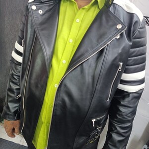 May include: A black leather jacket with white stripes on the sleeves and shoulders. The jacket has a zipper closure and multiple pockets.